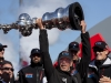 Larry Ellison lifting the America's cup for the second time.